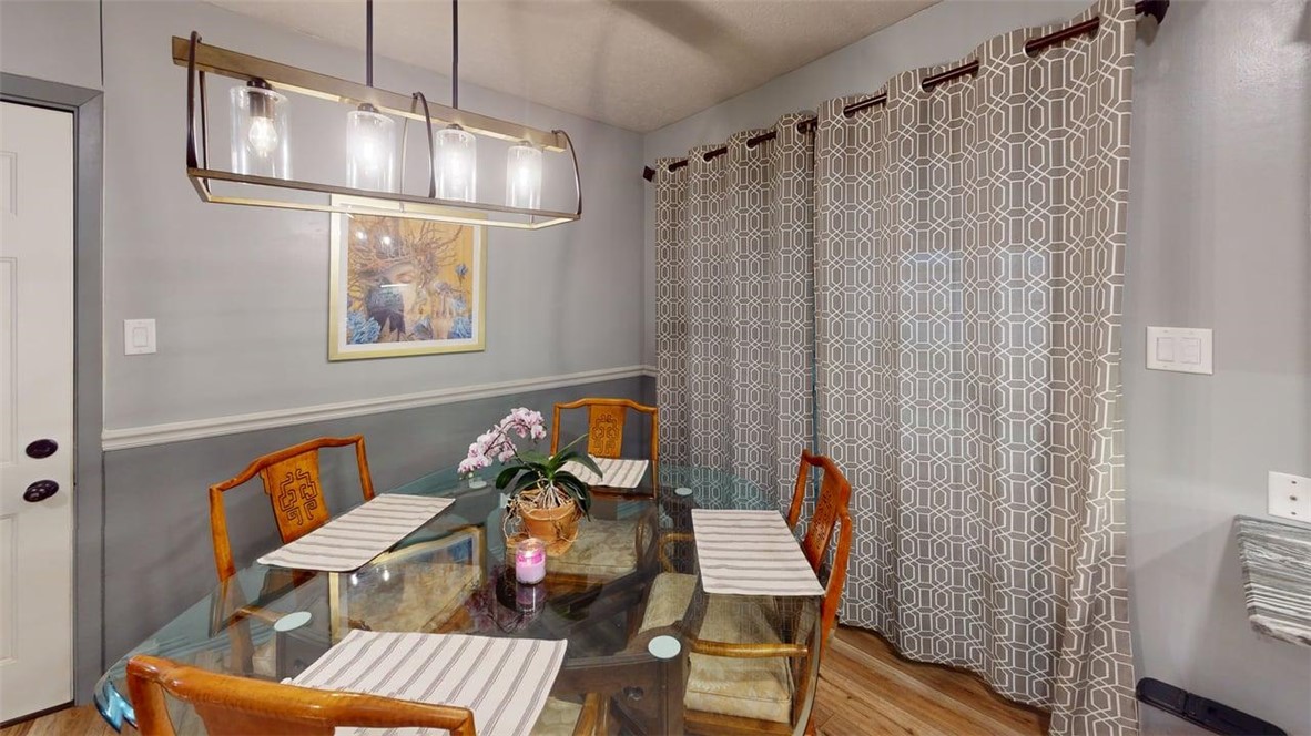 2108 Pantera Drive Bryan, TX 77807 - Photo 10 of 20 a view of a dining room with furniture wooden floor and fan
