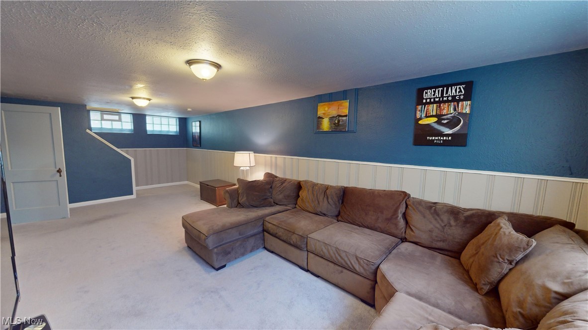 2412 Charney Road Cleveland, OH 44118 - Photo 36 of 48 Carpeted living room with a textured ceiling