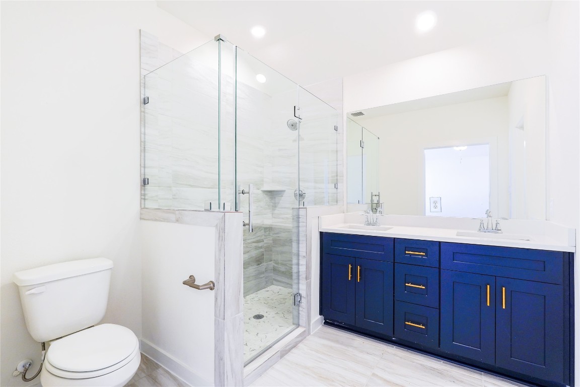 6618 Escondido Drive Rosharon, TX 77583 - Photo 20 of 31 a bathroom with a sink a toilet and shower