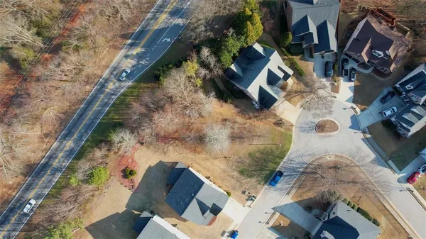 a bird view of house with backyard