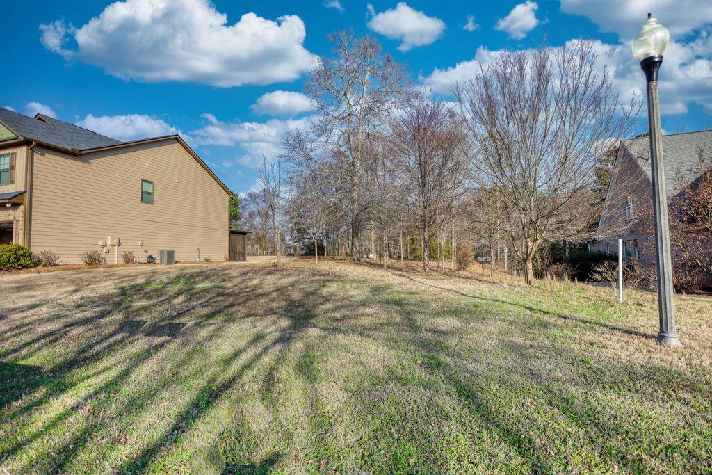9142 Golfview Circle Covington, GA 30014 - Photo 5 of 11 a view of back yard of the house
