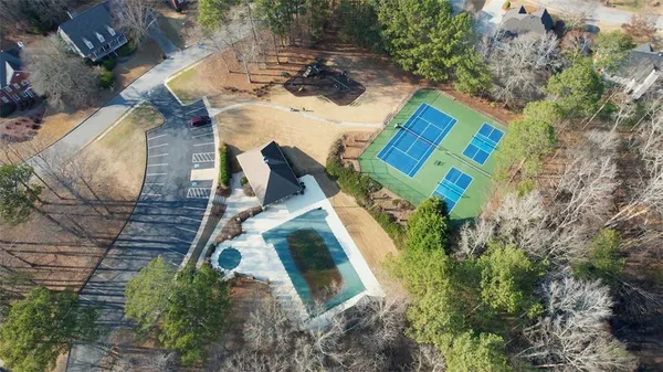 an aerial view of a house with outdoor space