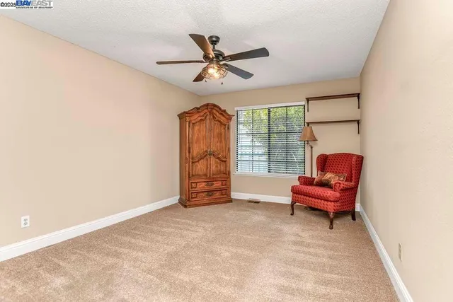 a furnished livingroom with a window