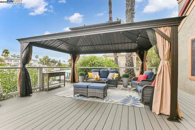a view of living room with balcony and furniture