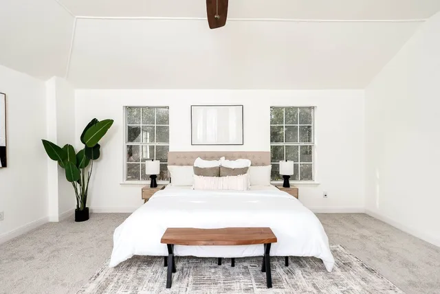 a living room with furniture and white walls
