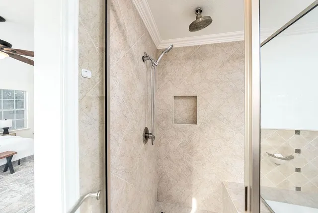 a bathroom with a bathtub and a shower