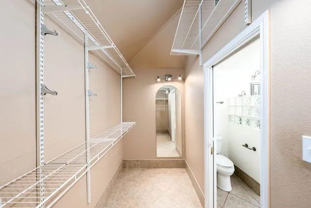 a view of an empty walk in closet