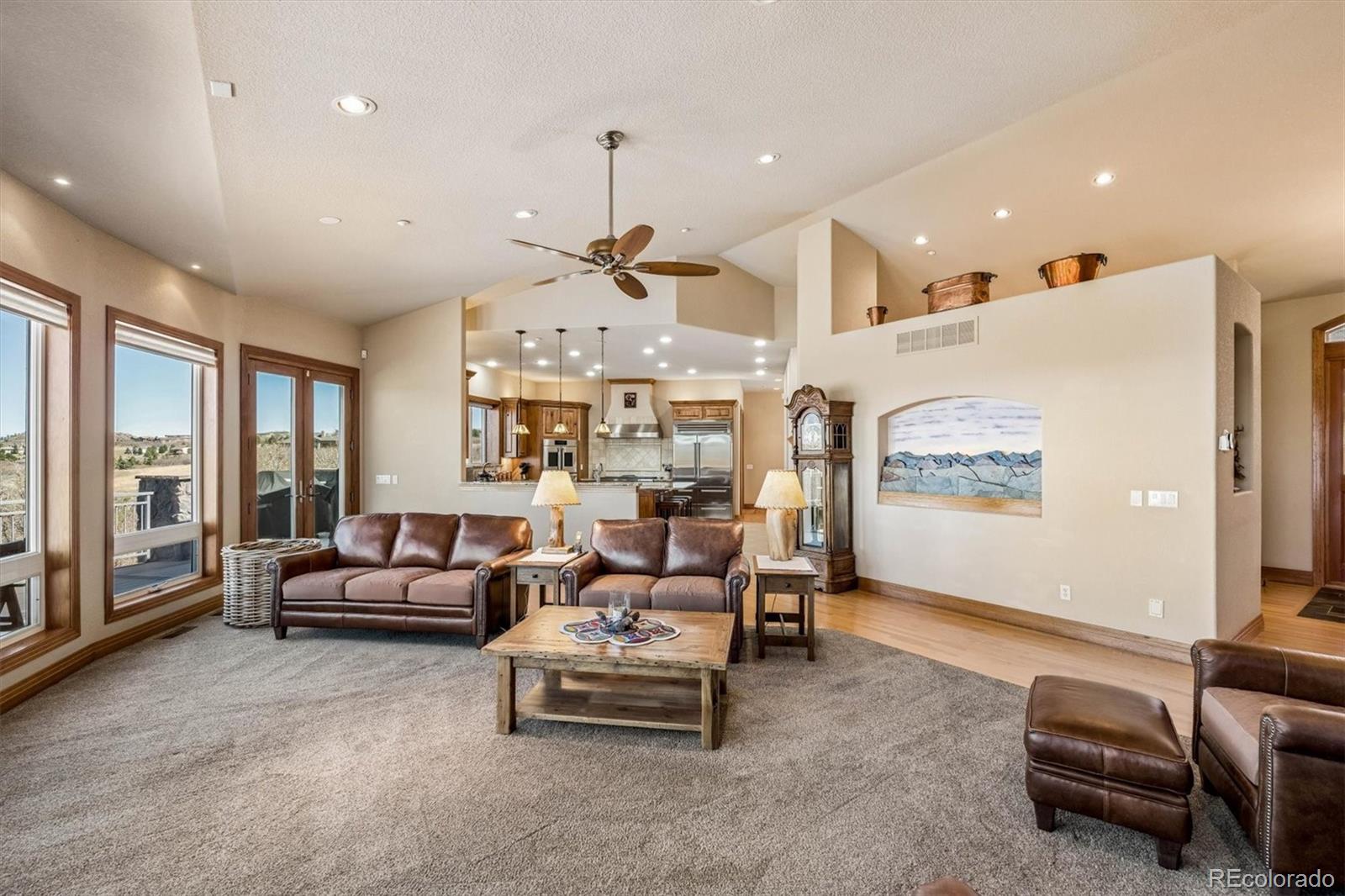 3959 Serenade Road Castle Rock, CO 80104 - Photo 13 of 50 a living room with furniture and a flat screen tv