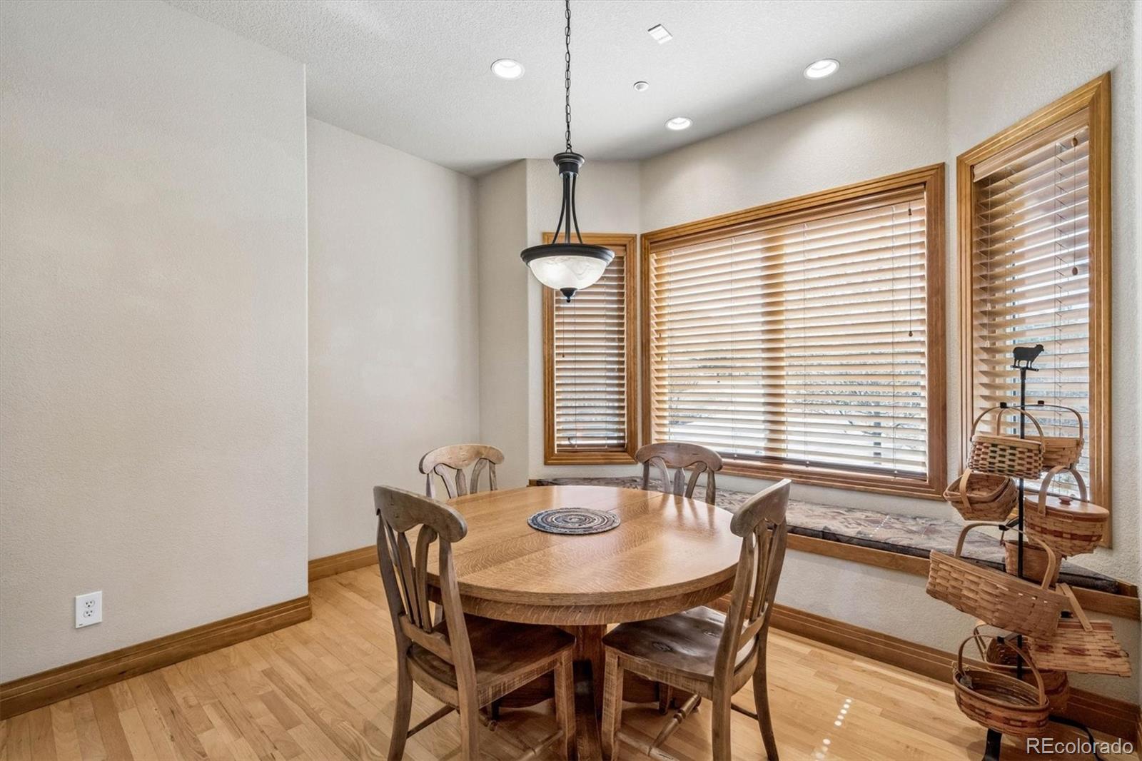 3959 Serenade Road Castle Rock, CO 80104 - Photo 23 of 50 a dining room with furniture and window