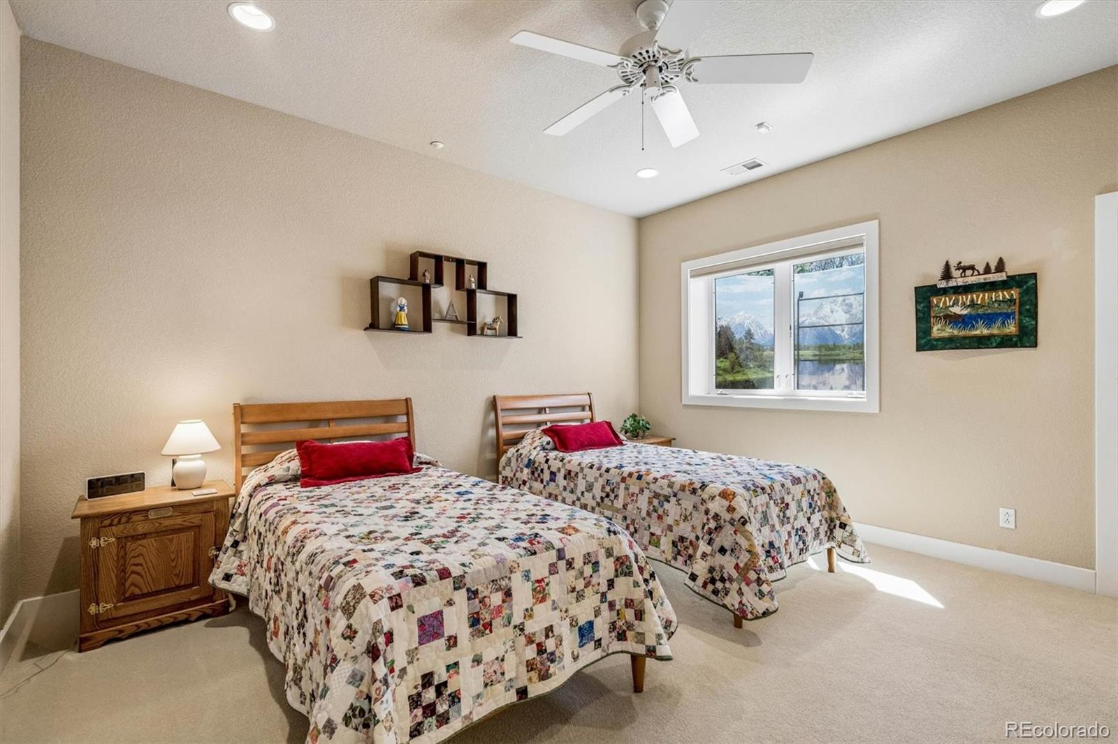 3959 Serenade Road Castle Rock, CO 80104 - Photo 34 of 50 a bedroom with two beds and a desk