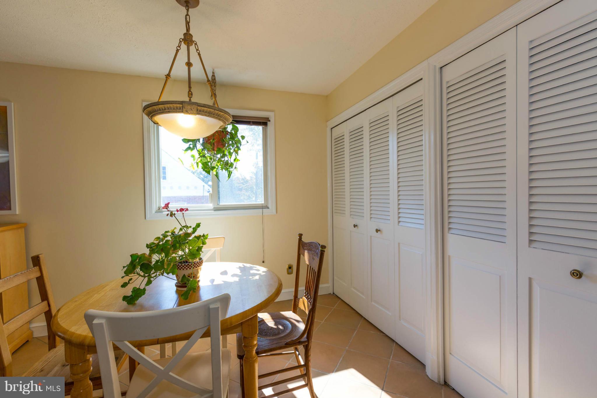 207 Indian Spring Drive Silver Spring, MD 20901 - Photo 14 of 30 a dining room with furniture and a chandelier