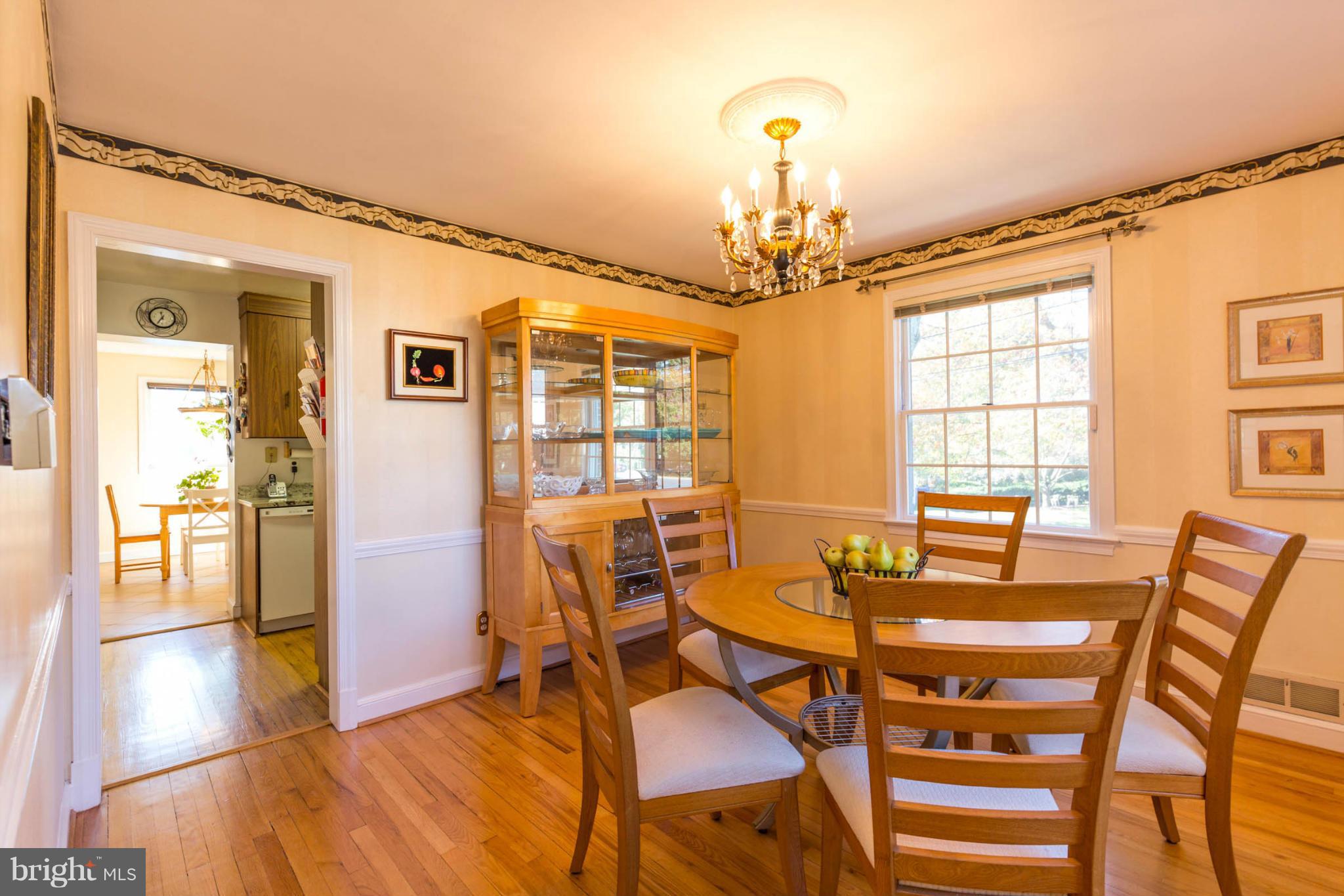 207 Indian Spring Drive Silver Spring, MD 20901 - Photo 16 of 30 a view of a dining room with furniture and wooden floor