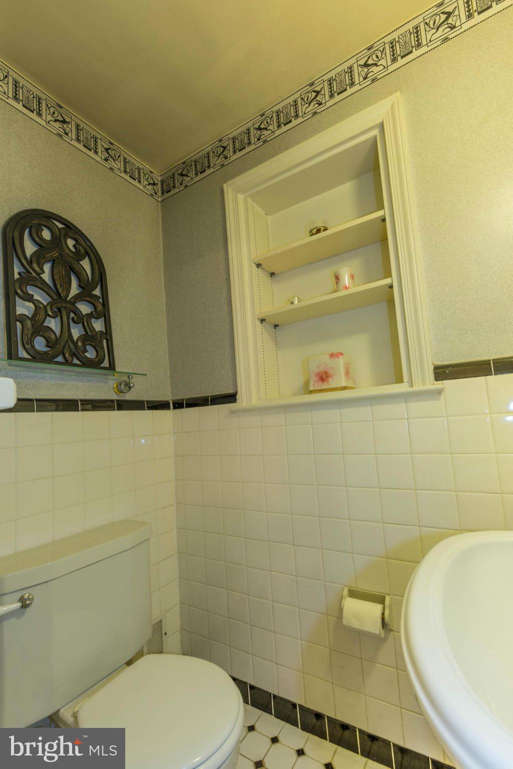 207 Indian Spring Drive Silver Spring, MD 20901 - Photo 17 of 30 a bathroom with a toilet and a sink