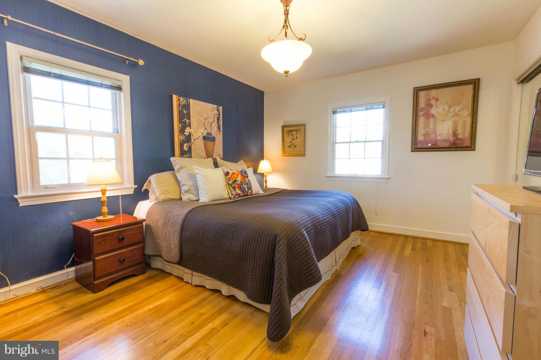 207 Indian Spring Drive Silver Spring, MD 20901 - Photo 18 of 30 a bed room with a bed and a window