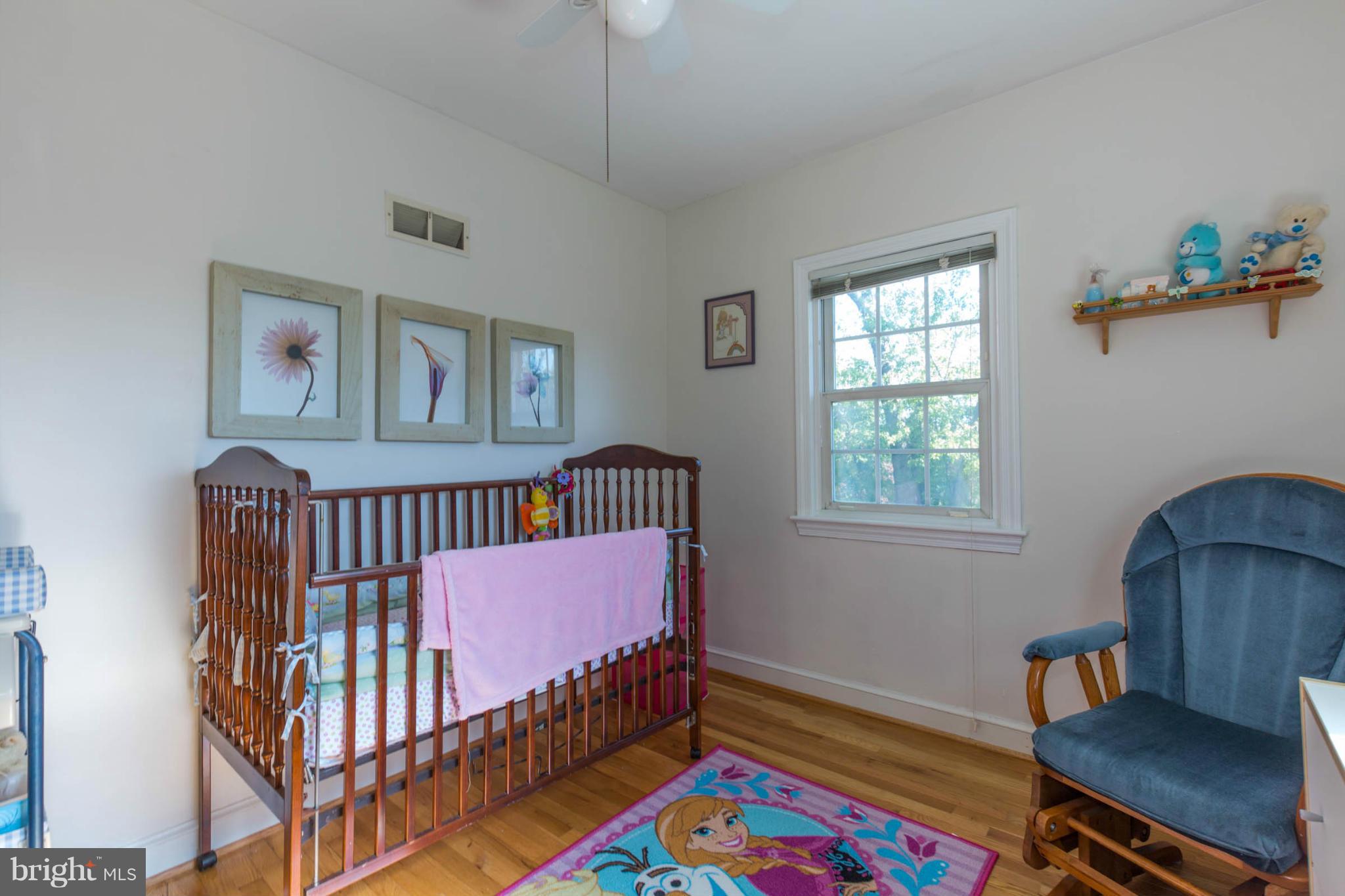 207 Indian Spring Drive Silver Spring, MD 20901 - Photo 20 of 30 a bedroom with furniture and a window