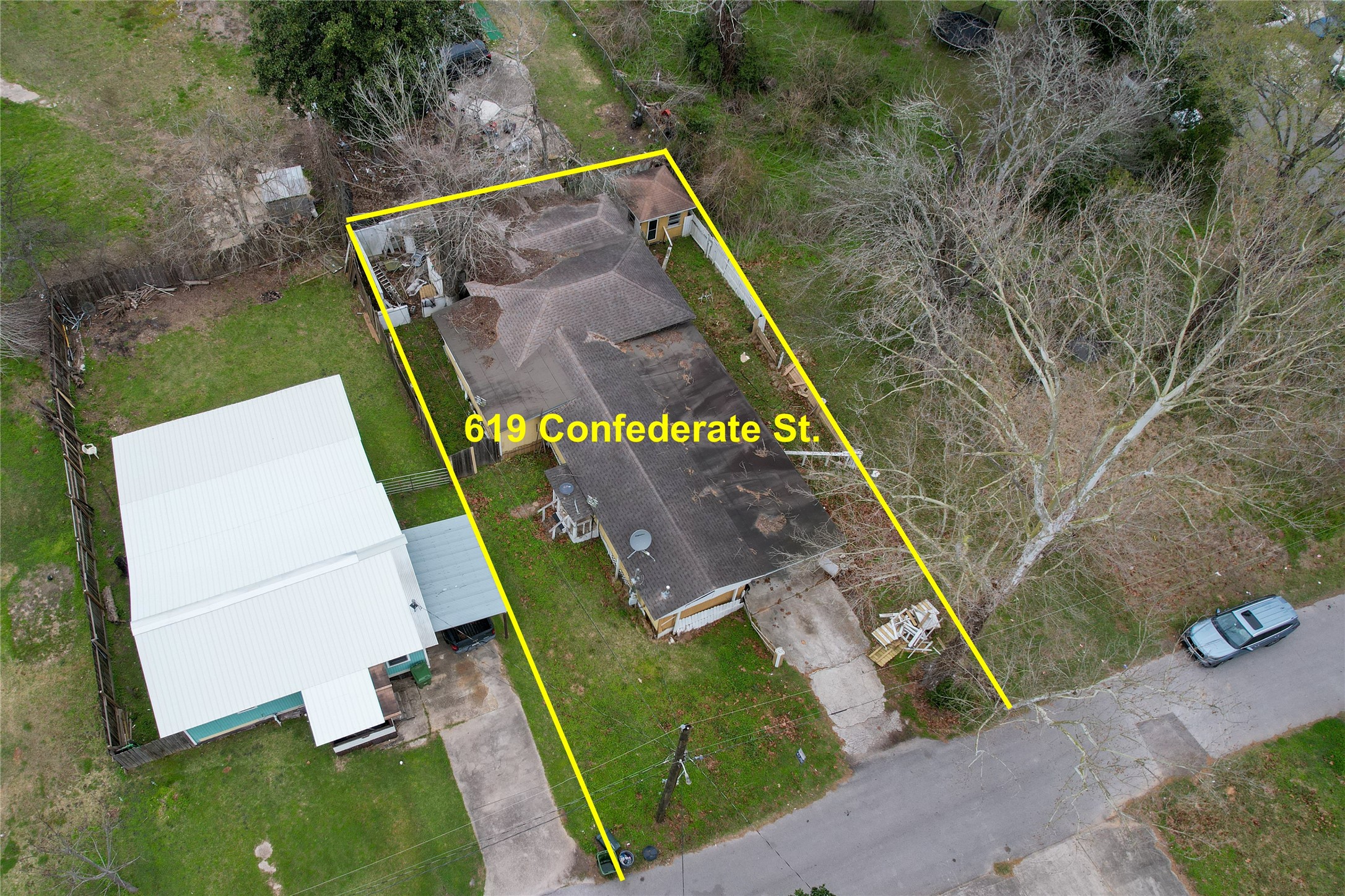 619 Confederate Street Liberty, TX 77575 - Photo 4 of 7 an aerial view of a backyard with chairs