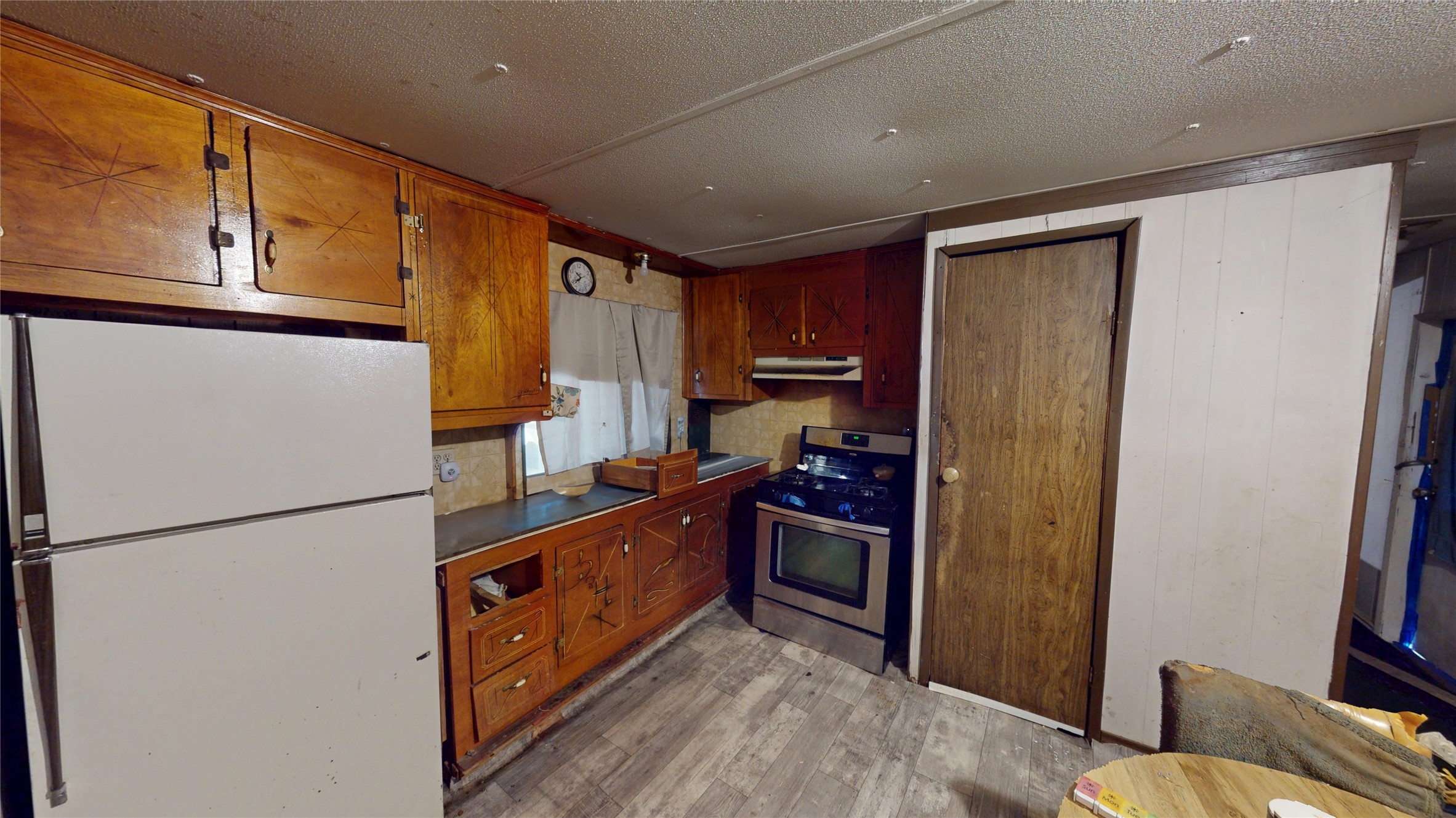 619 Confederate Street Liberty, TX 77575 - Photo 5 of 7 a kitchen with stainless steel appliances granite countertop a refrigerator a stove a sink and dishwasher
