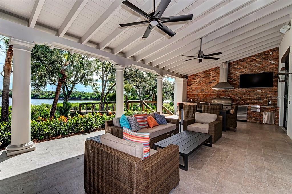 1624 Rio Vista Terrace Parrish, FL 34219 - Photo 10 of 13 a outdoor space with patio lots of furniture and a grill