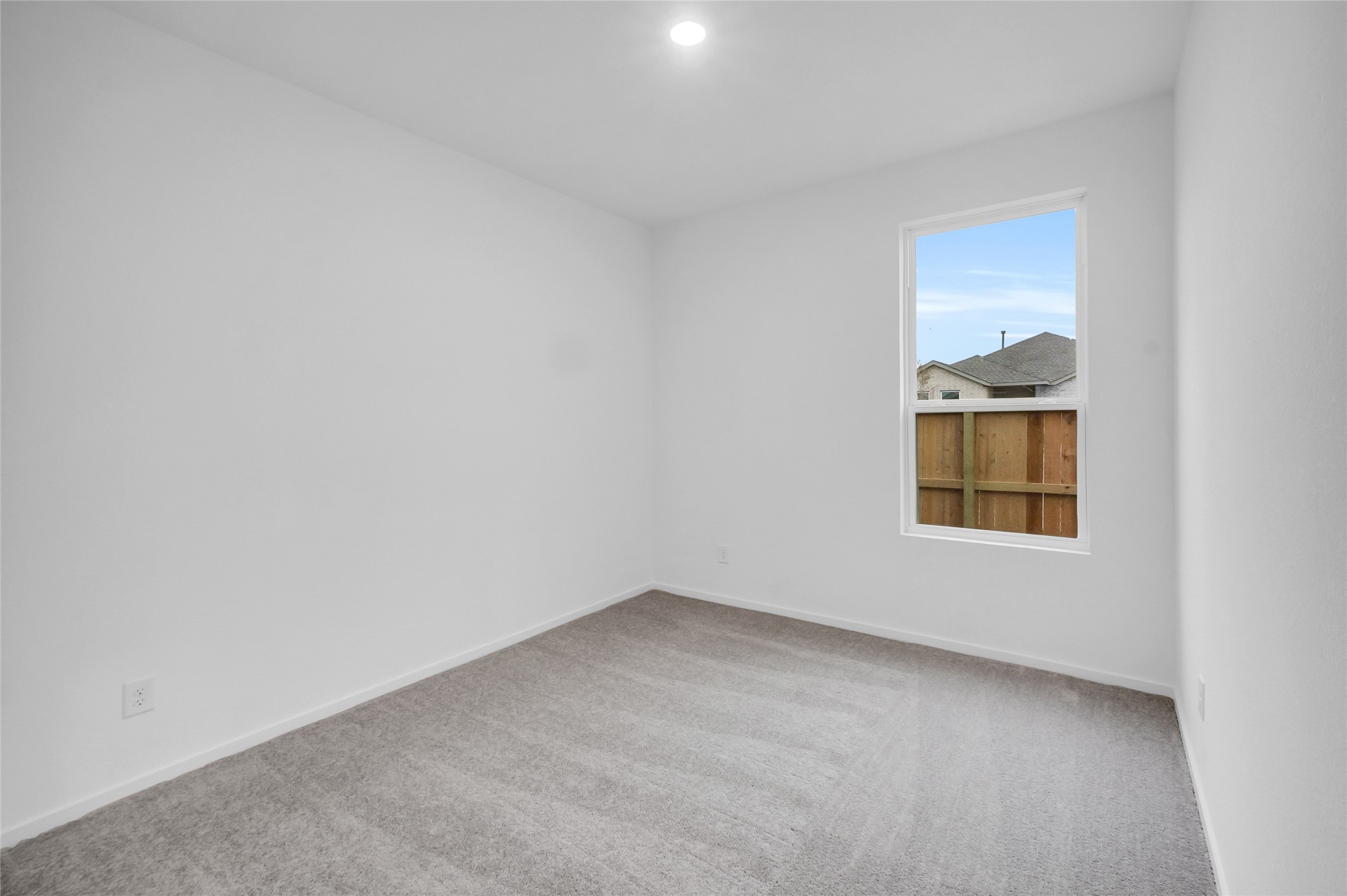 22011 Maddaloni View Drive Hockley, TX 77447 - Photo 16 of 33 an empty room with a window