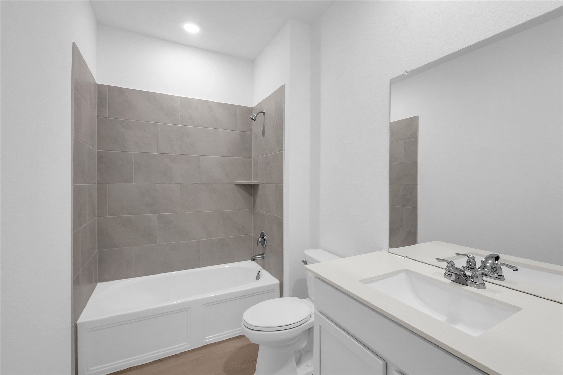 22011 Maddaloni View Drive Hockley, TX 77447 - Photo 12 of 33 a bathroom with a sink a toilet and bathtub