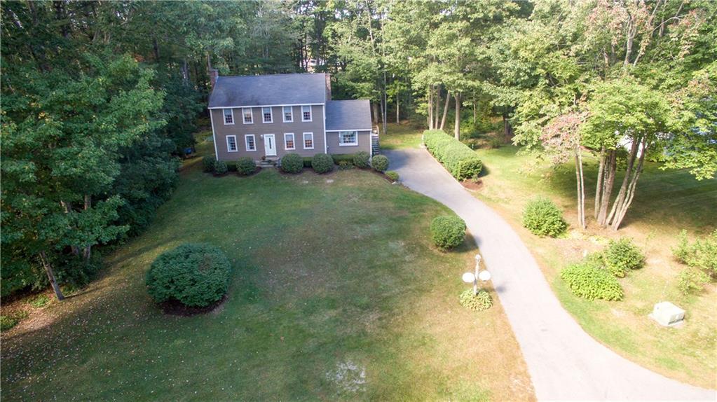 Aerial of front yard, driveway and...