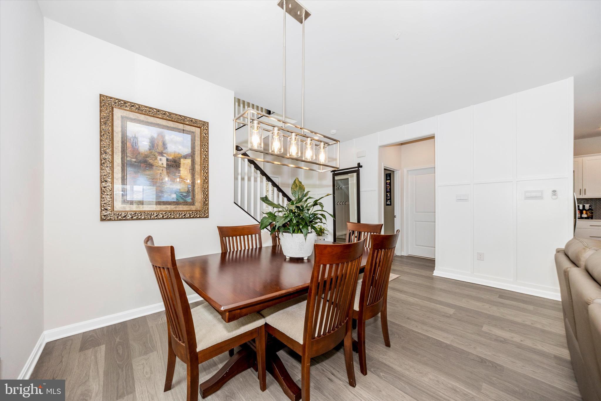 700 Bond Street Frederick, MD 21701 - Photo 6 of 49 a dining room with furniture and wooden floor