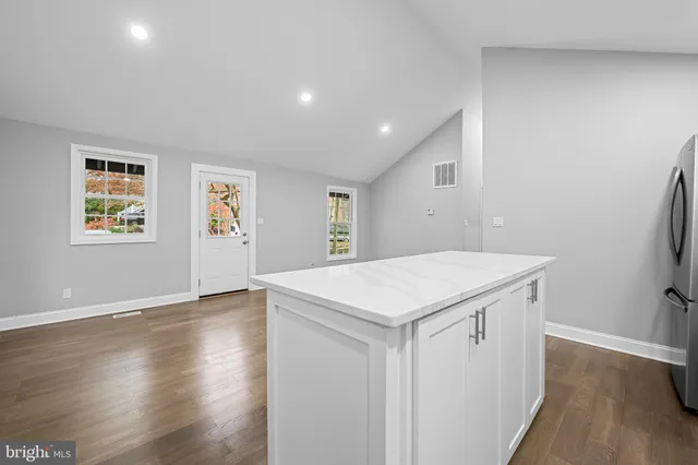 a view of utility room with wooden floor