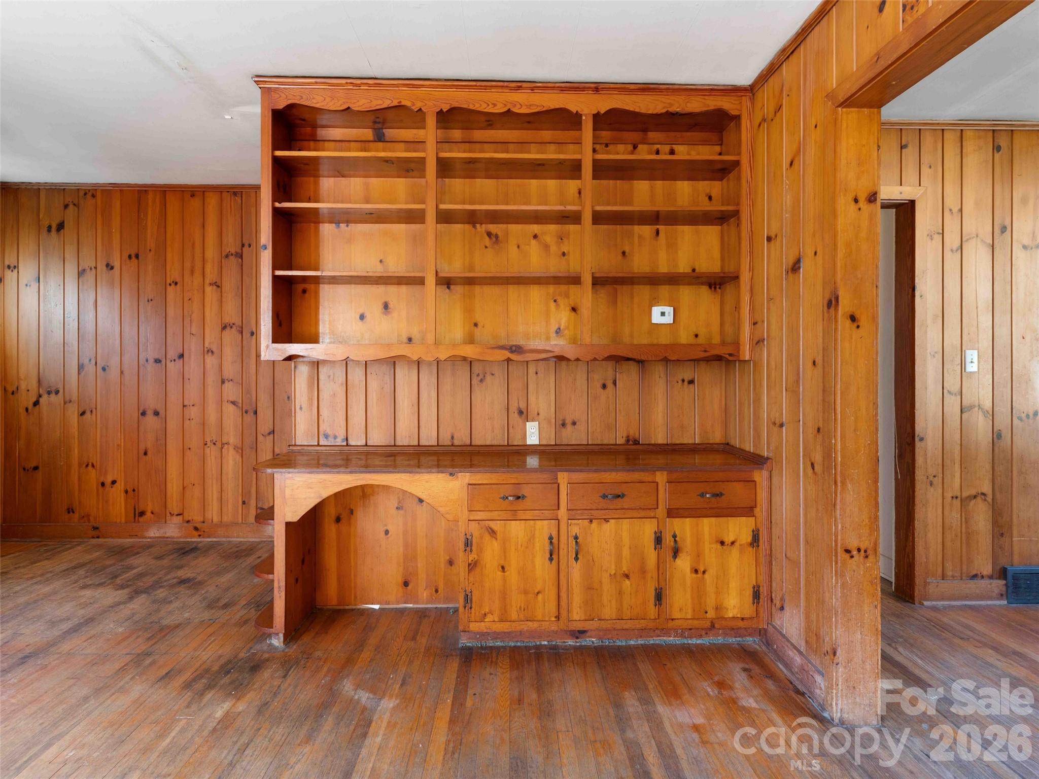 118 Rutledge Drive Hendersonville, NC 28739 - Photo 11 of 48 a view of a room with wooden floor and cabinet
