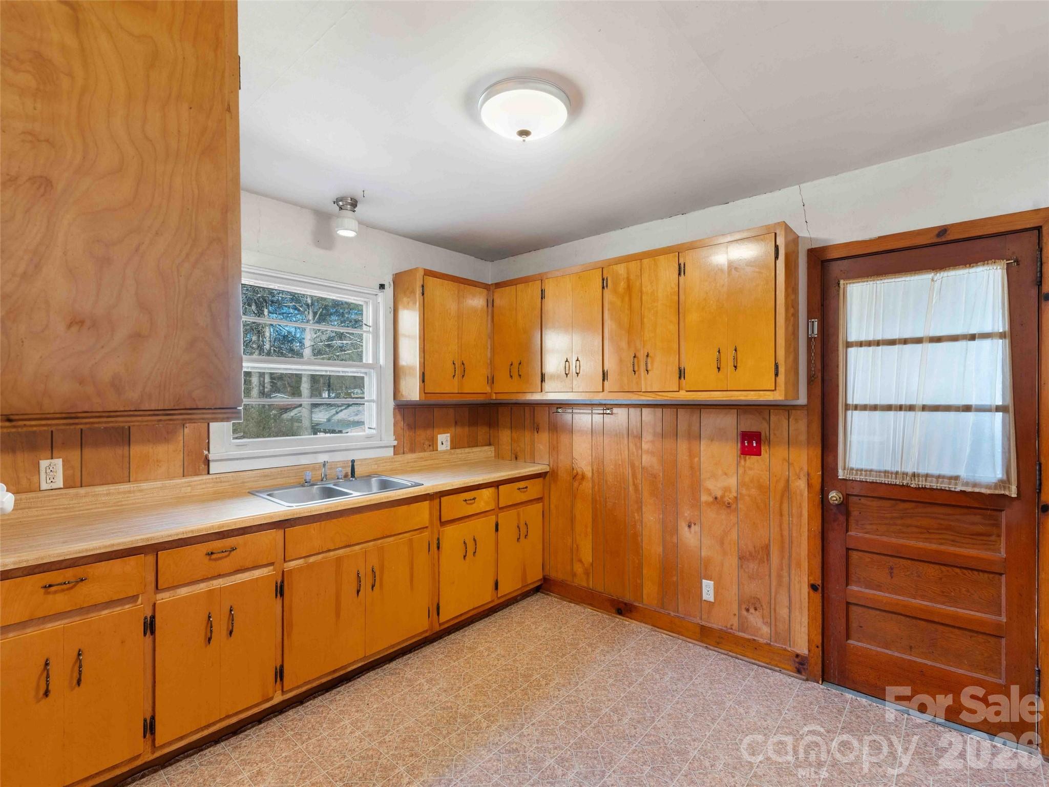 118 Rutledge Drive Hendersonville, NC 28739 - Photo 16 of 48 a view of a kitchen with sink cabinets and a window