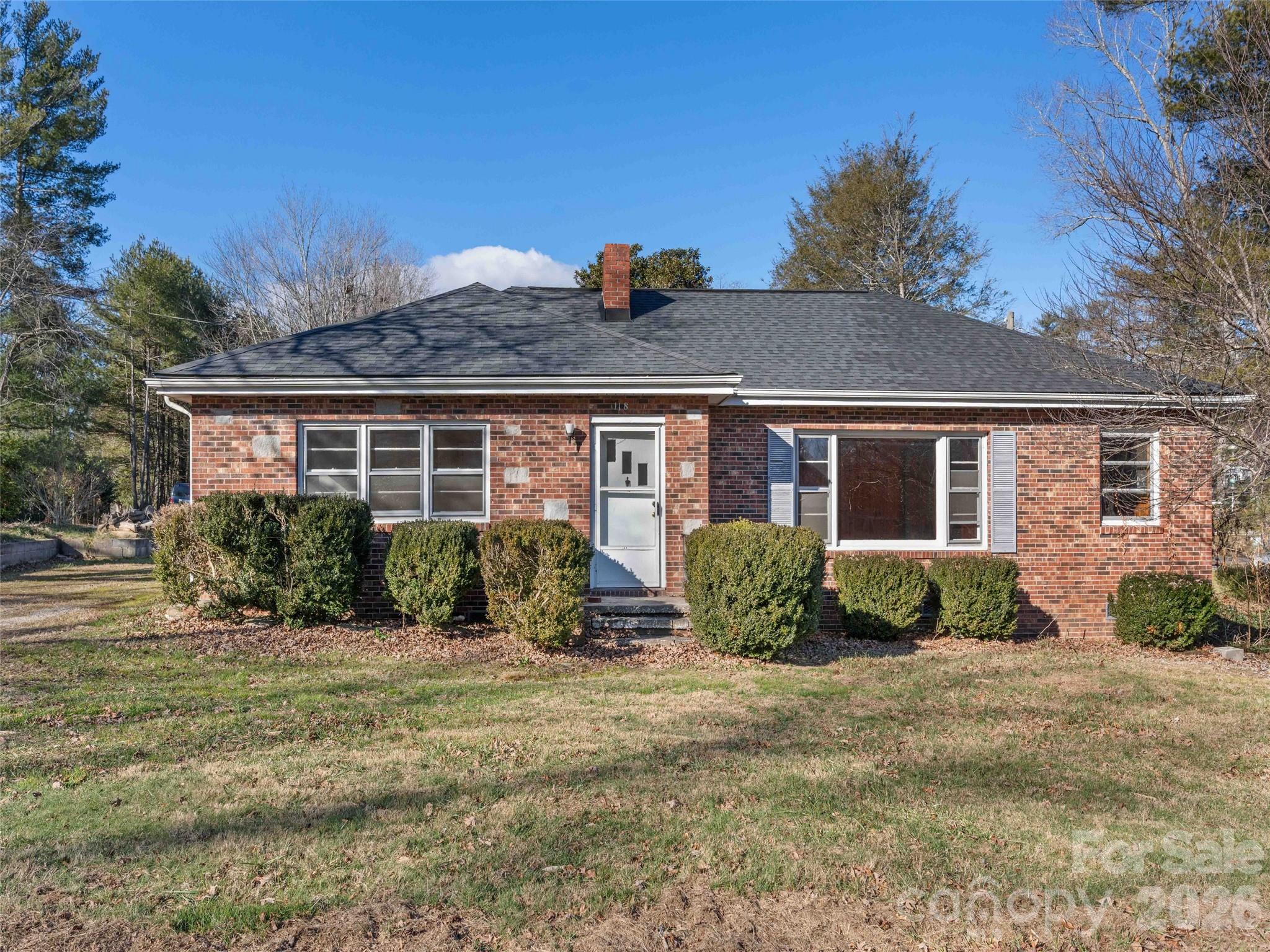 118 Rutledge Drive Hendersonville, NC 28739 - Photo 2 of 48 a front view of a house with a yard