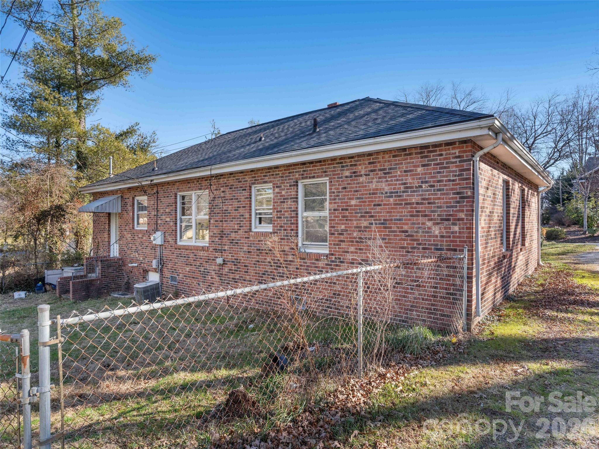 118 Rutledge Drive Hendersonville, NC 28739 - Photo 24 of 48 a front view of a house with garden