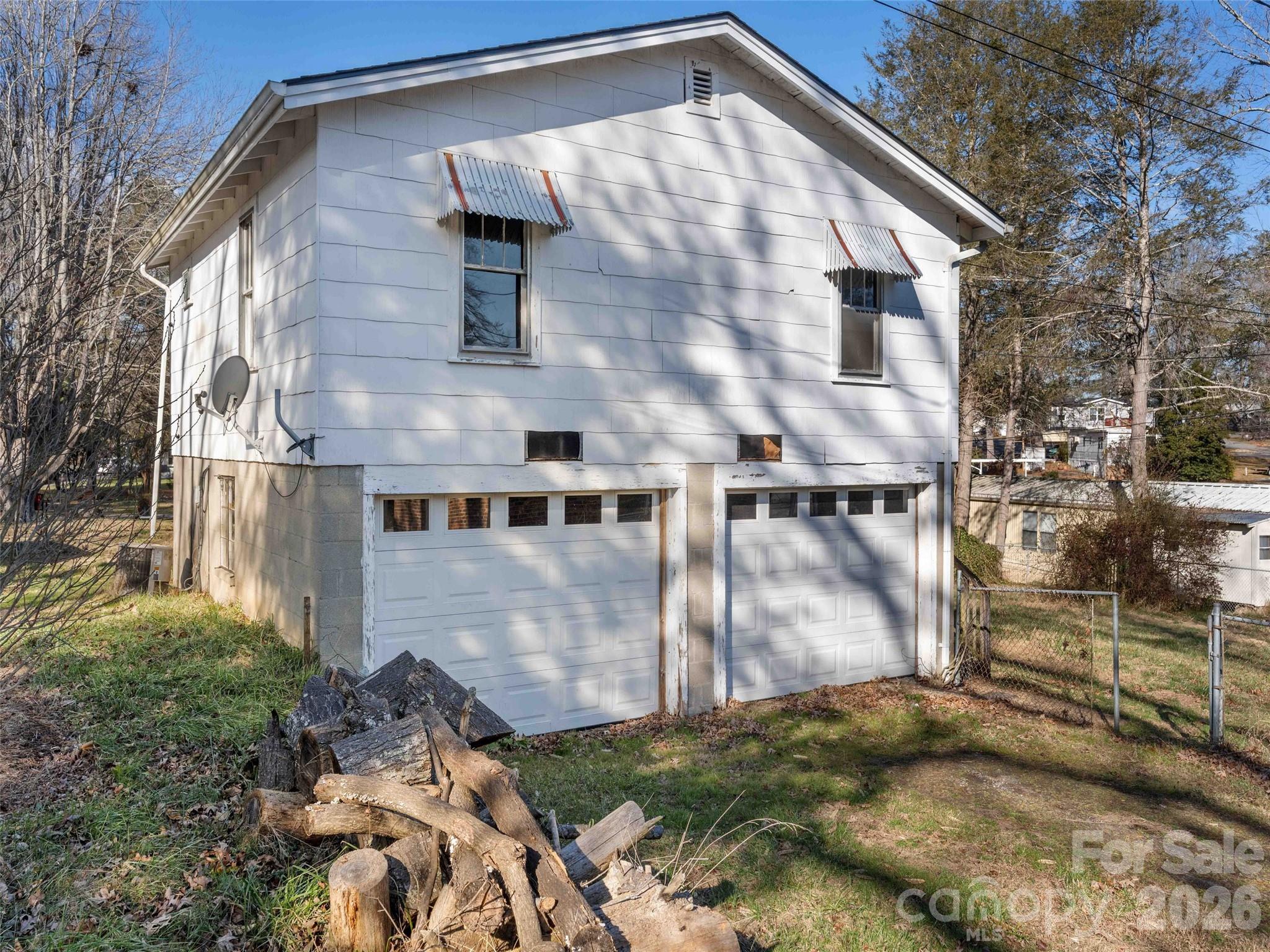 118 Rutledge Drive Hendersonville, NC 28739 - Photo 26 of 48 a front view of a house with a yard