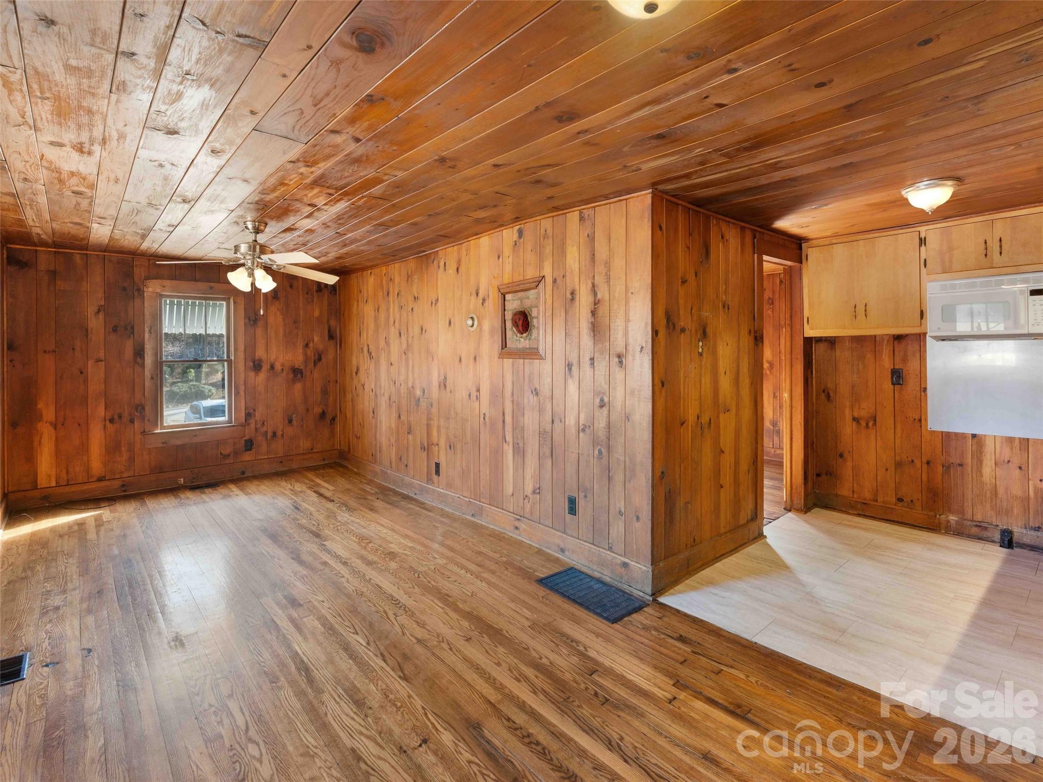 118 Rutledge Drive Hendersonville, NC 28739 - Photo 31 of 48 a view of empty room with wooden floor and fan