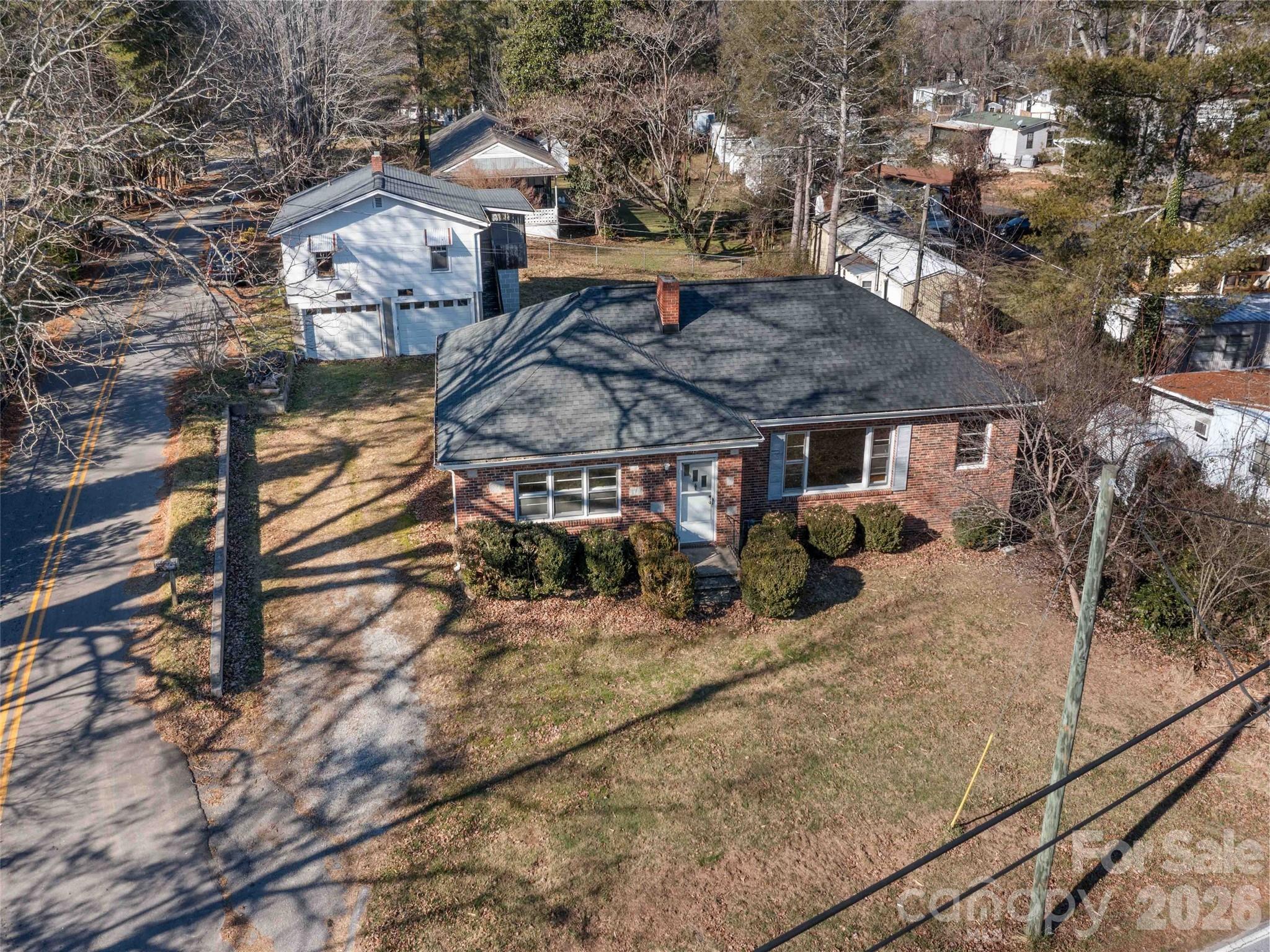 118 Rutledge Drive Hendersonville, NC 28739 - Photo 4 of 48 a view of a house with backyard and sitting area