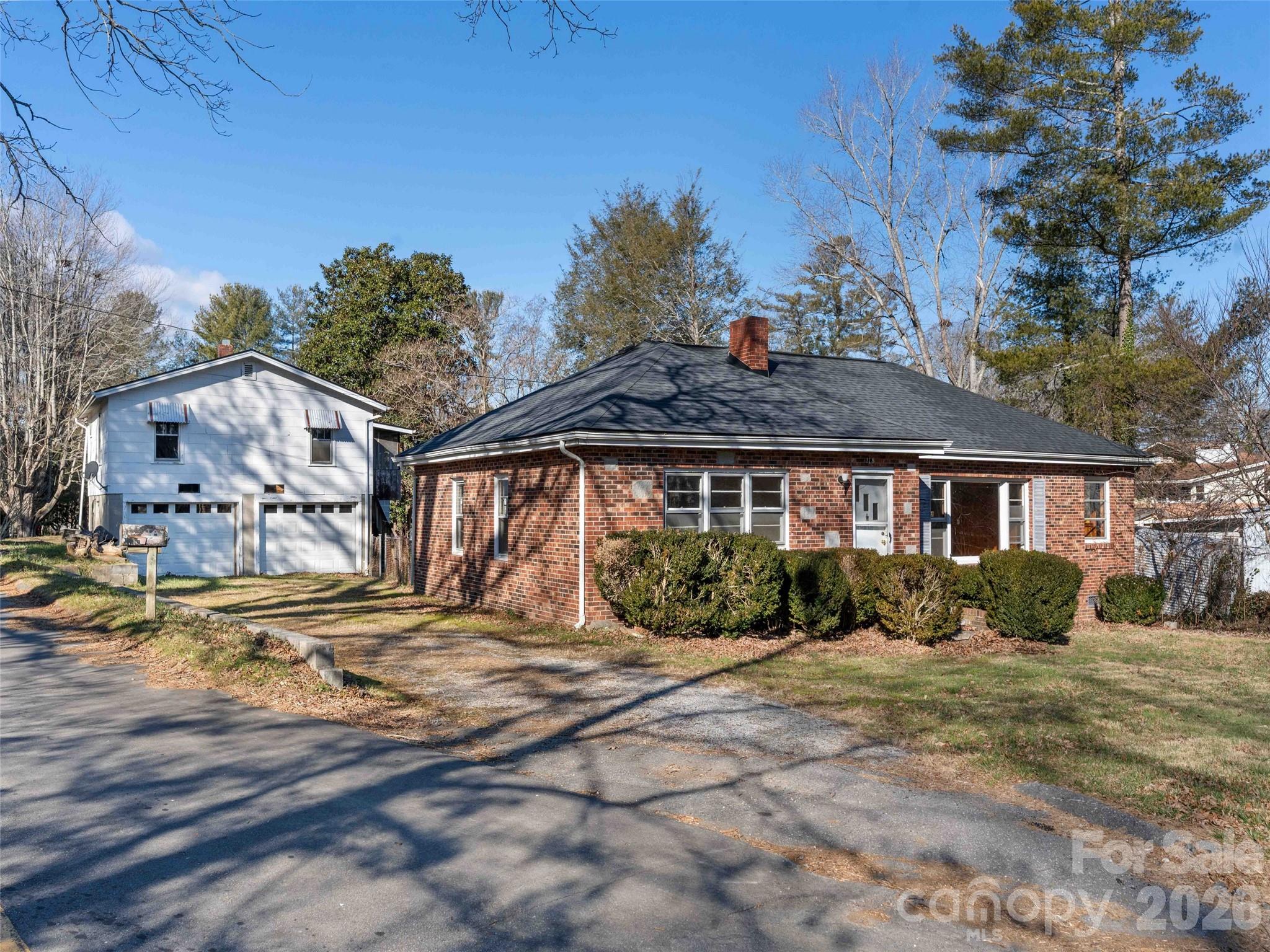 118 Rutledge Drive Hendersonville, NC 28739 - Photo 6 of 48 a front view of a house with a yard