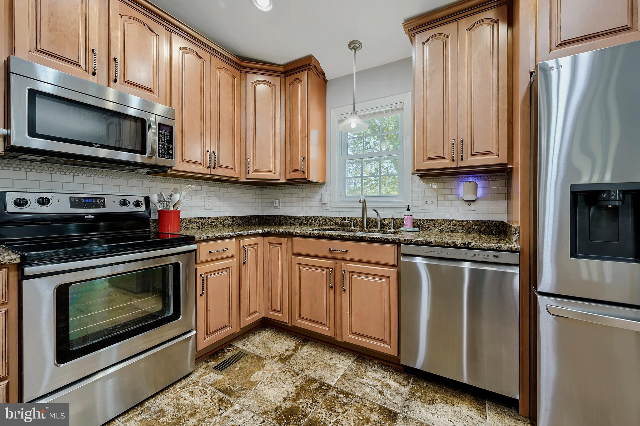 8105 Beverly Road Severn, MD 21144 - Photo 12 of 31 Granite counters and SS appliances