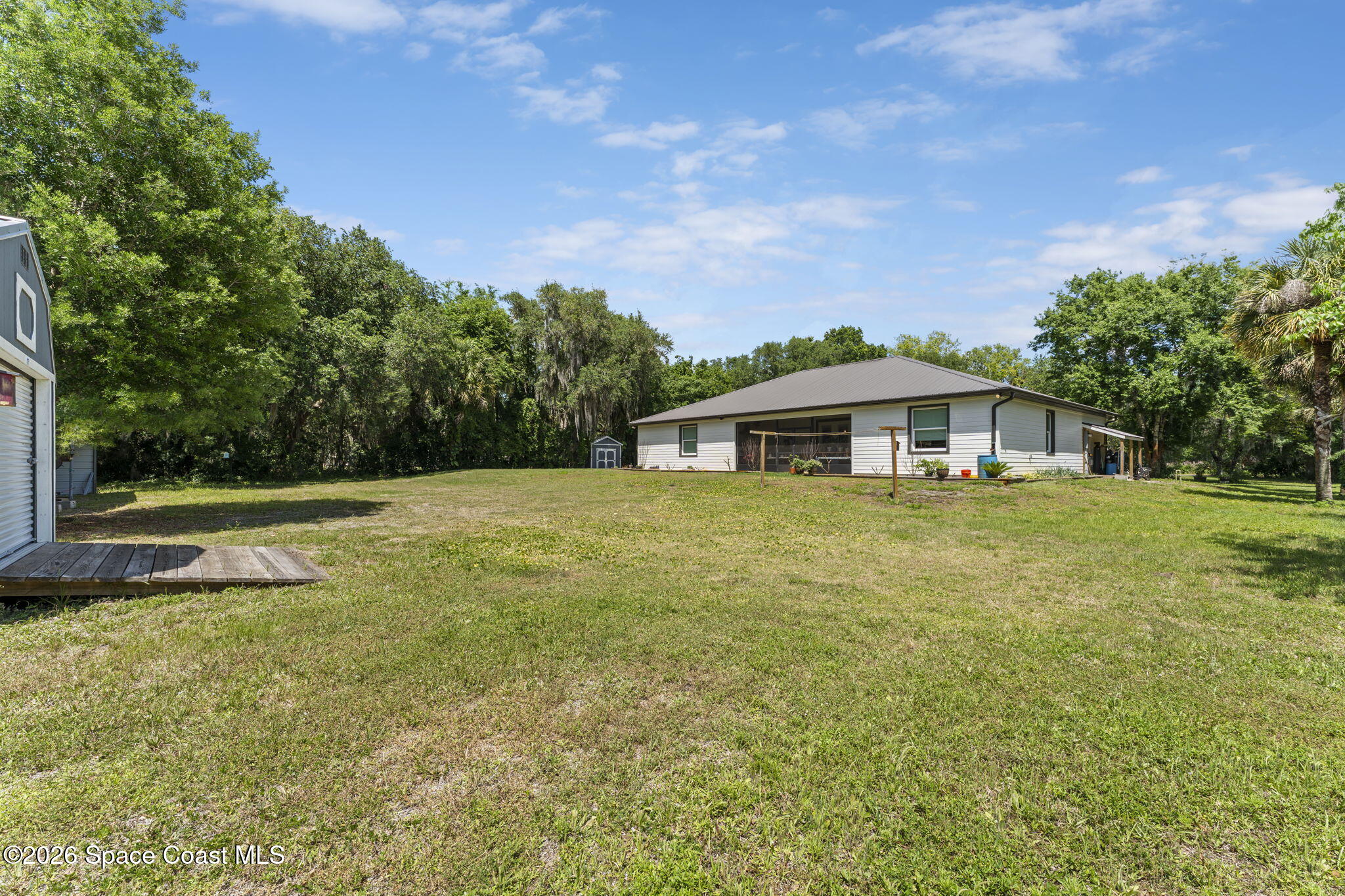 1740 Ford Road Mims, FL 32754 - Photo 39 of 43 a front view of a house with a yard