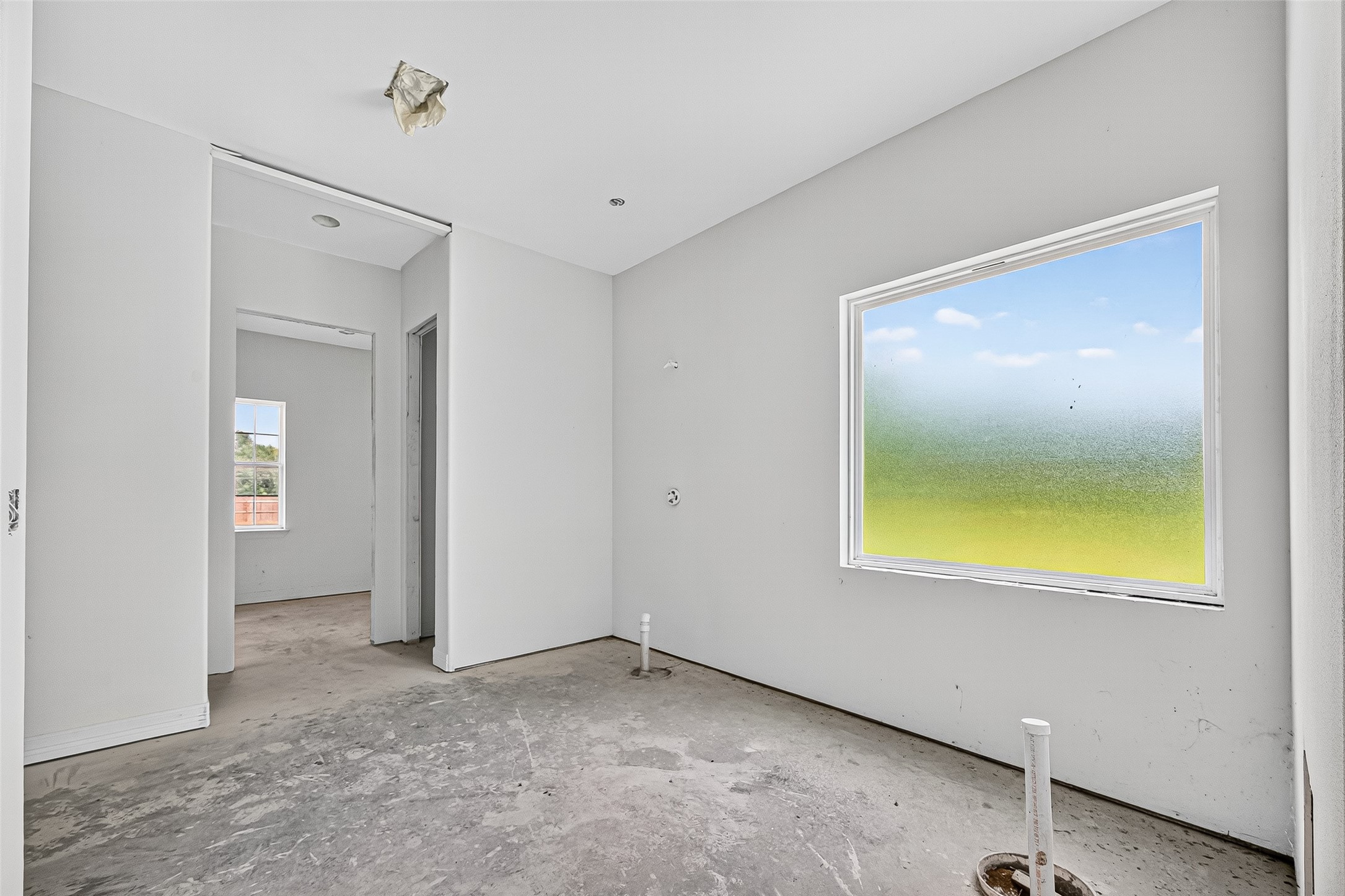 1013 Battlebell Road Highlands, TX 77562 - Photo 16 of 47 a view of an empty room with a window and a bathroom