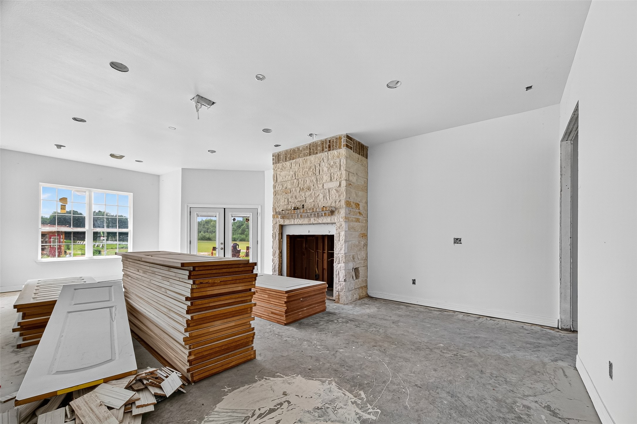 1013 Battlebell Road Highlands, TX 77562 - Photo 20 of 47 a living room with furniture a fireplace and a large window