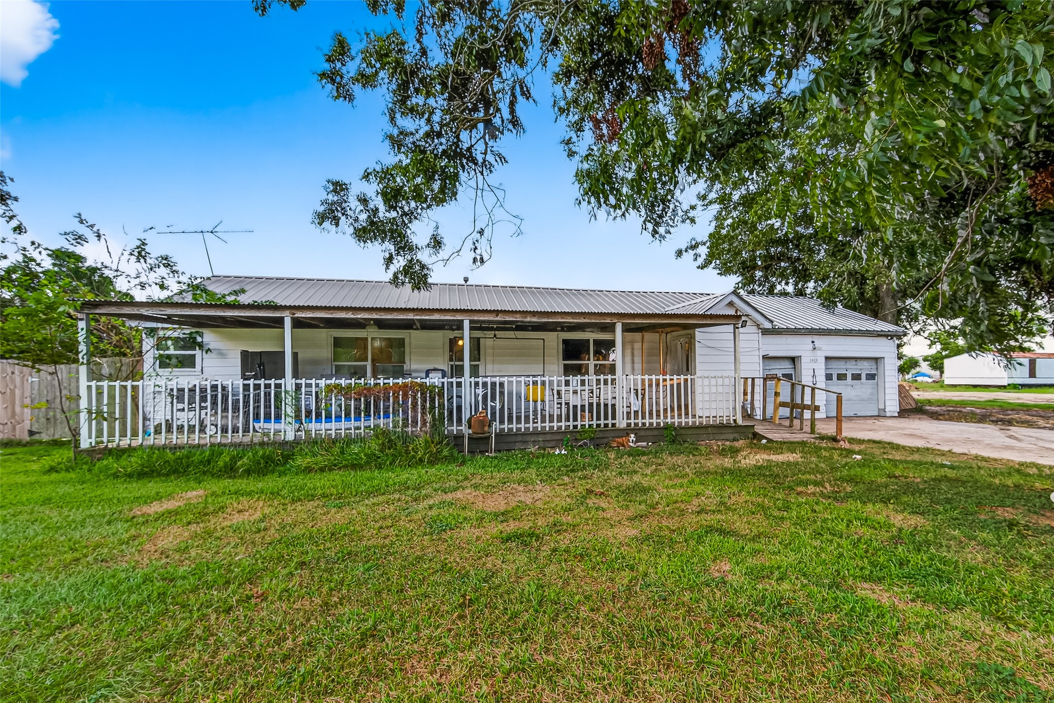 1013 Battlebell Road Highlands, TX 77562 - Photo 2 of 47 a front view of a house with a garden