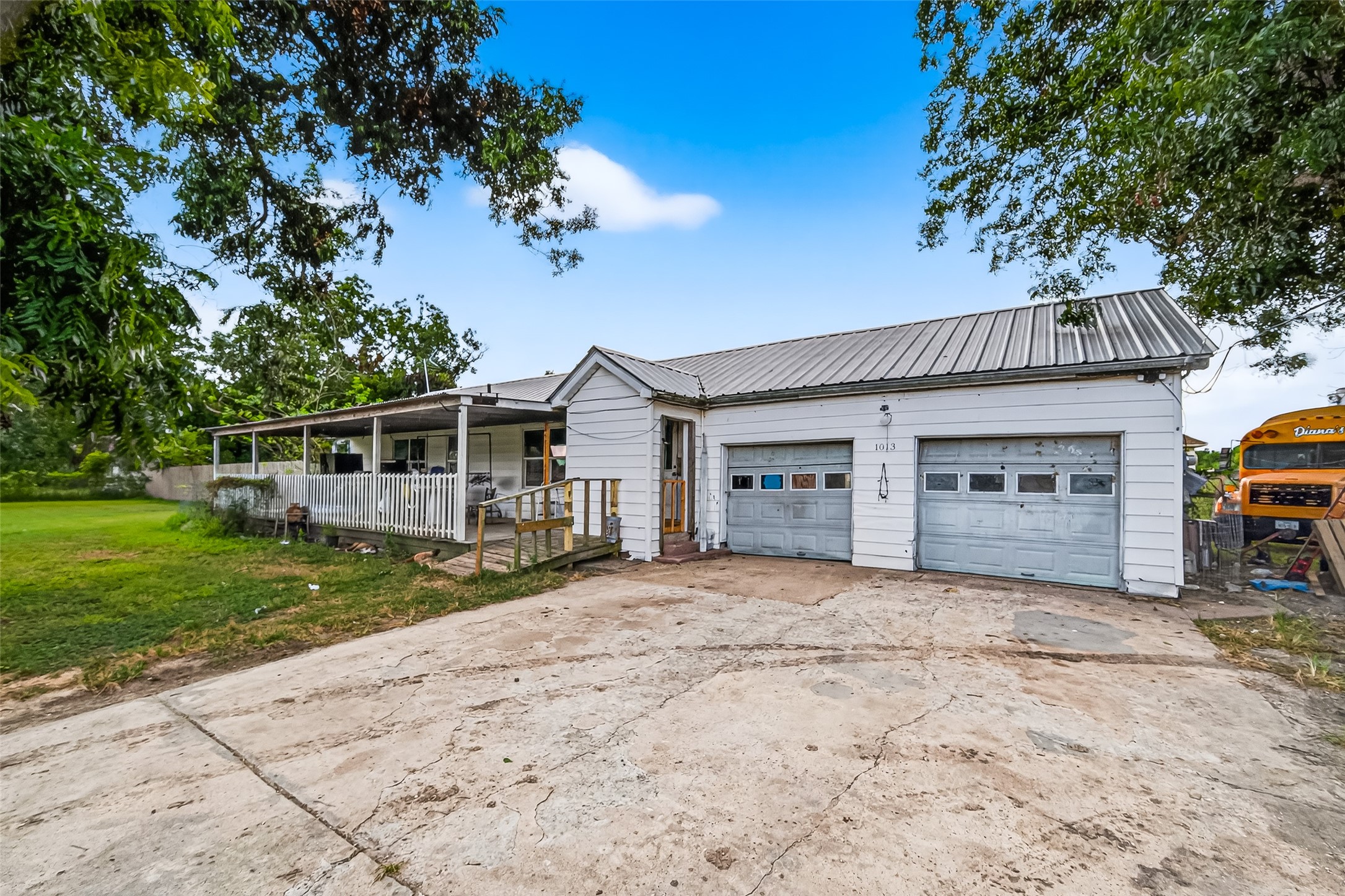 1013 Battlebell Road Highlands, TX 77562 - Photo 32 of 47 a front view of a house with a yard and garage