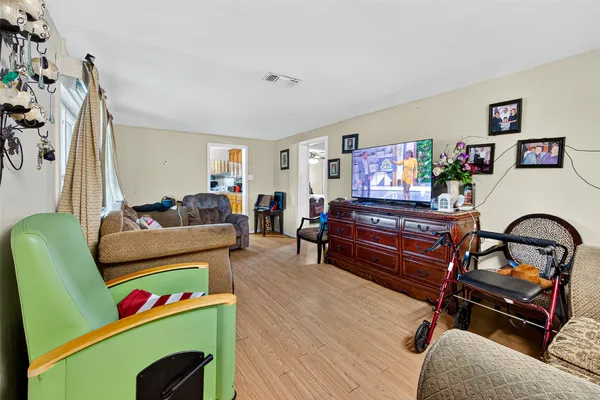 a living room with furniture and a large window