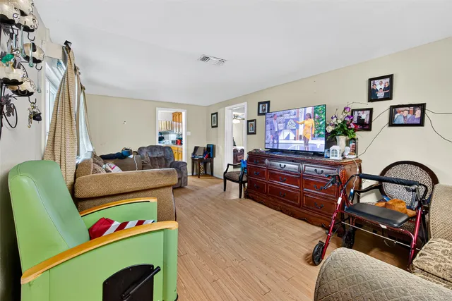a living room with furniture and a large window