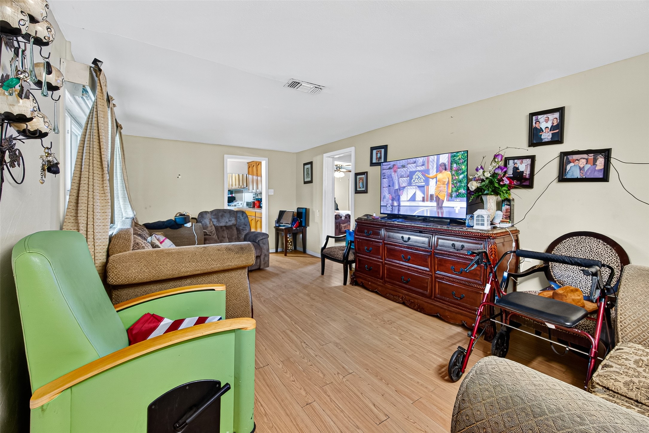 1013 Battlebell Road Highlands, TX 77562 - Photo 33 of 47 a living room with furniture and a wooden floor
