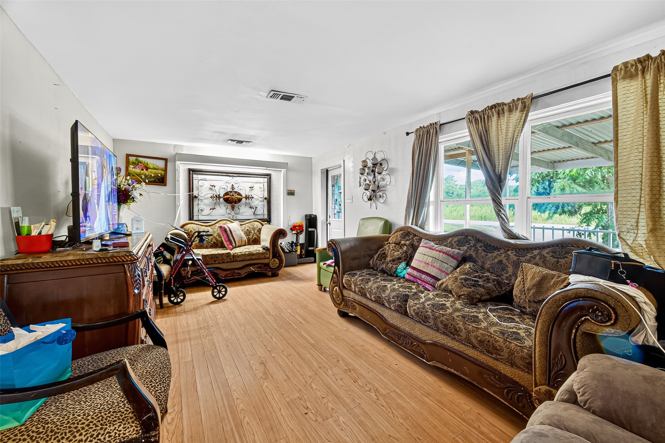 1013 Battlebell Road Highlands, TX 77562 - Photo 34 of 47 a living room with furniture and a large window