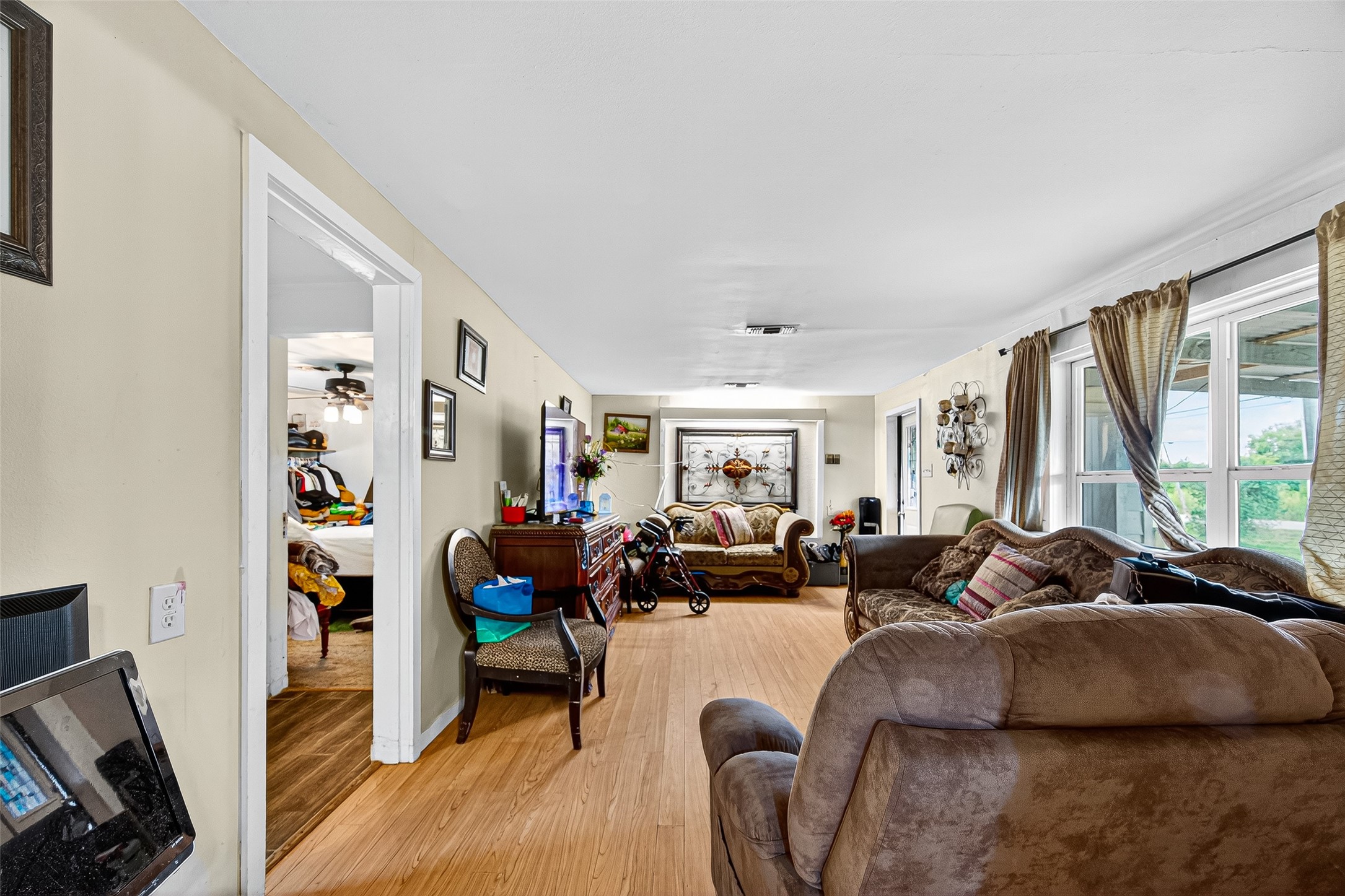 1013 Battlebell Road Highlands, TX 77562 - Photo 35 of 47 a living room with furniture fireplace and a large window