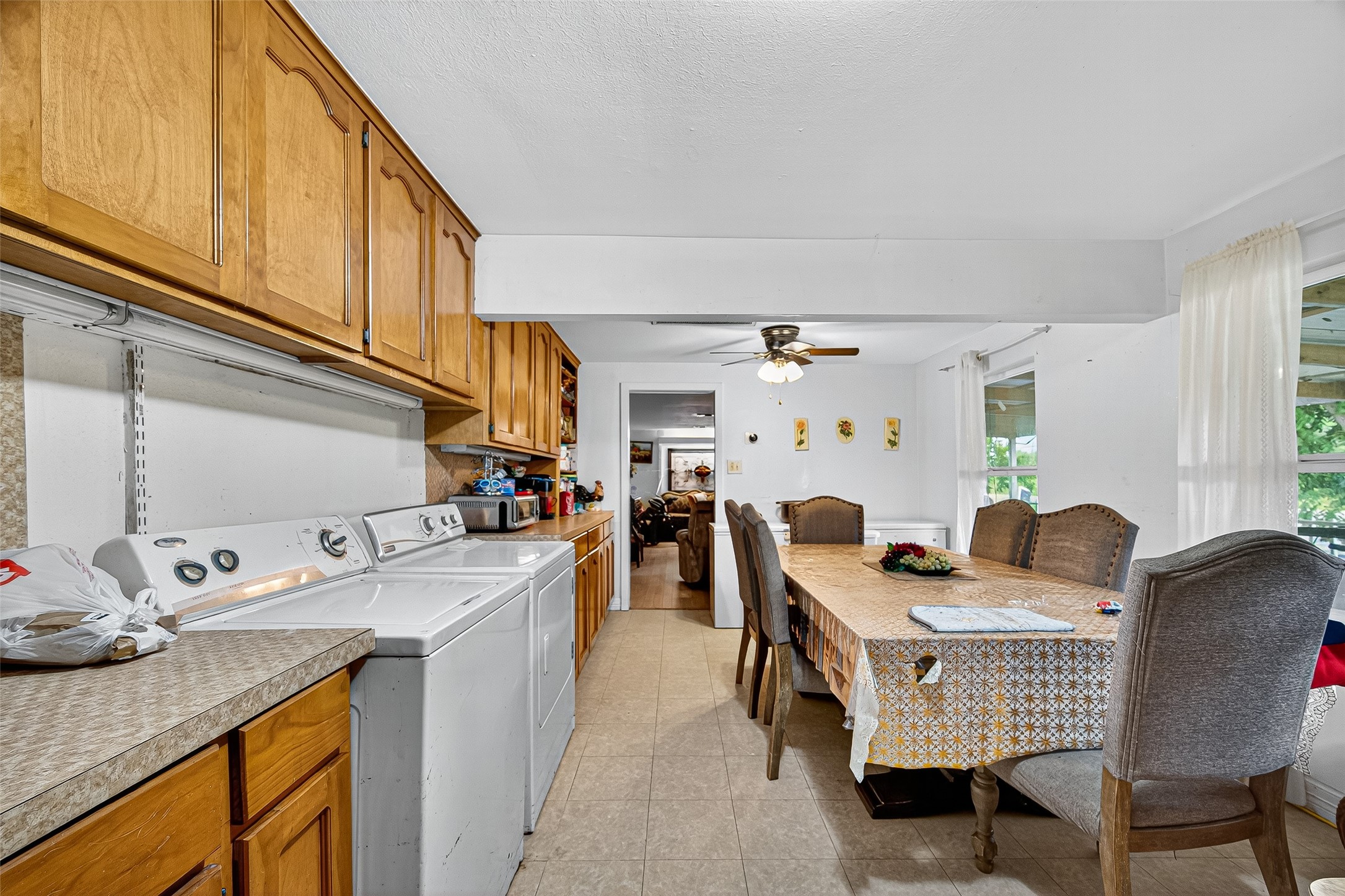1013 Battlebell Road Highlands, TX 77562 - Photo 39 of 47 a kitchen that has a lot of cabinets a sink and a wooden floor