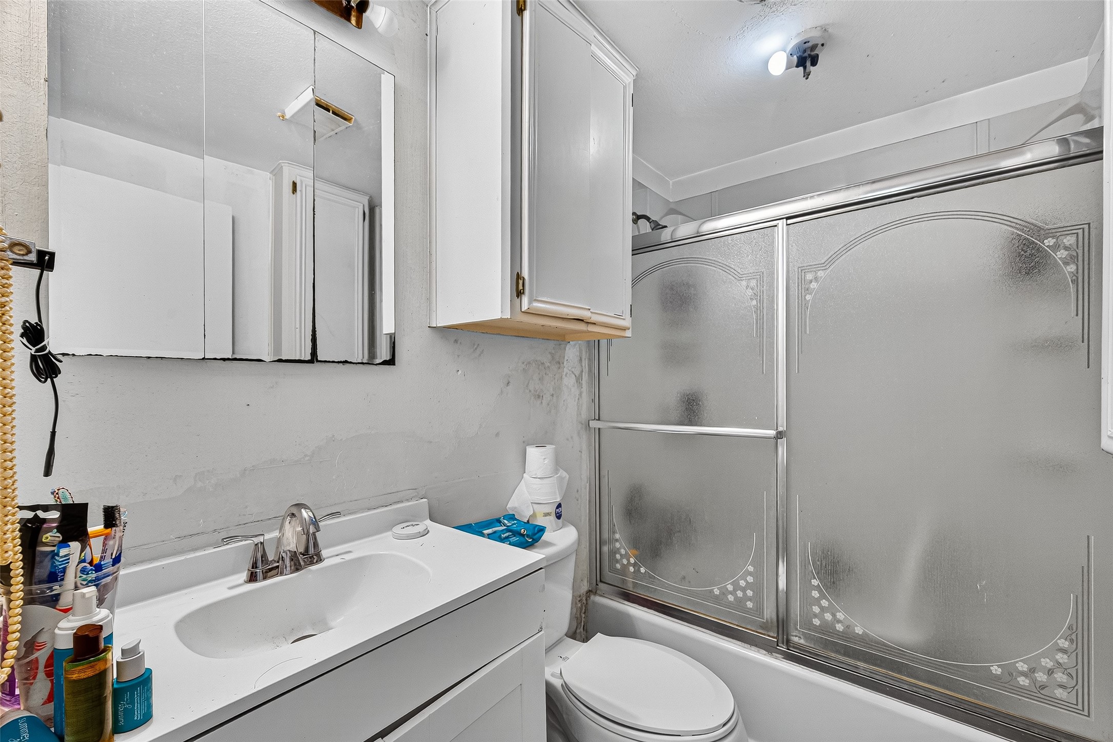 1013 Battlebell Road Highlands, TX 77562 - Photo 44 of 47 a bathroom with a sink toilet and shower