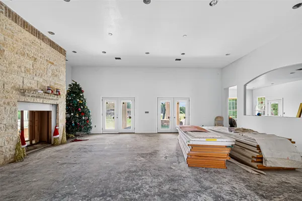 a bedroom with furniture and a fireplace