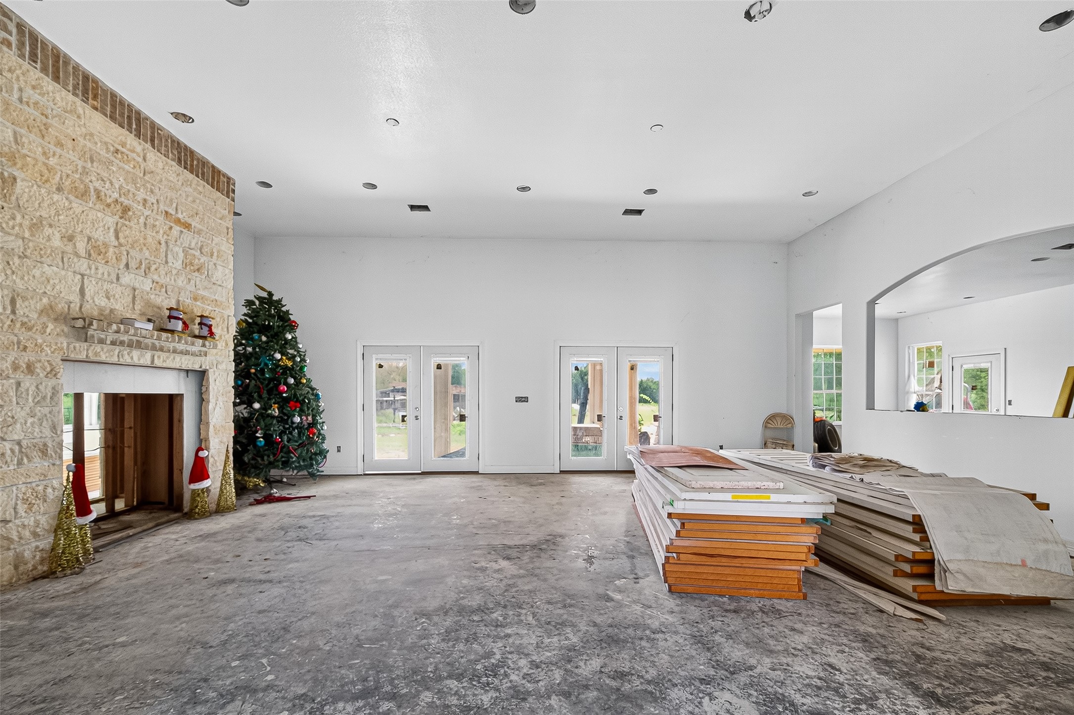 1013 Battlebell Road Highlands, TX 77562 - Photo 7 of 47 a bedroom with furniture and a fireplace